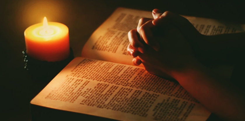 bible candle praying hands 840x415